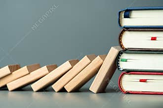 Domino effect stop at the books pile