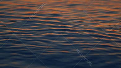 Gorgeous Contrast Between Warm Shades Of Sunset. Golden Colored Calm Sea Water At Sunset. Close up.