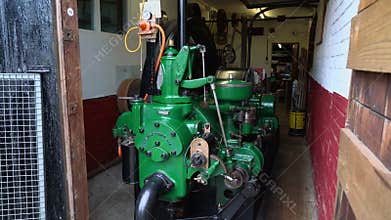 Vintage green Crossley Brothers gas engine originally built in 1920
