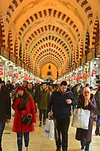 Spice Bazaar, Istanbul, Turkey, busy rush hour crowd of visitor tourists, local customers & passerby with shops on both sides