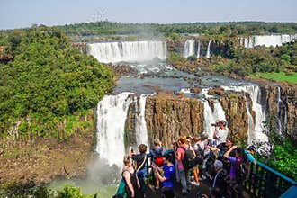 Tourists crowded at viewpoint platform in wonderful Iguacu Falls