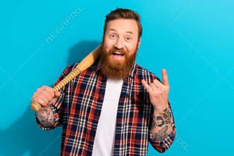 Thug life brutal hooligan mature age man baseball fan champion showing fingers punk gesture rude isolated on blue color