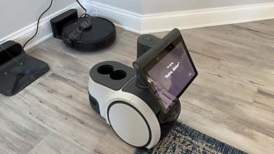 An Amazon Astro Robot moving around in a house