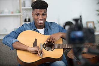 african musician playing guitar