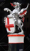 Dragon. and red cross shield of London City on plinth in city
