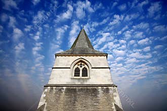 Church spire against a dramatic sky