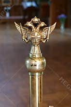 Double-headed eagle with two swords, cross and crown inside temple