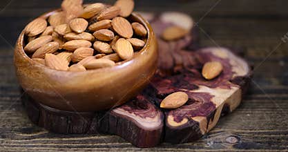 ready-to-eat almond nuts on a wooden table