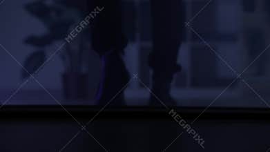 apartment security, man entered the premises for profit and theft at night, legs close-up