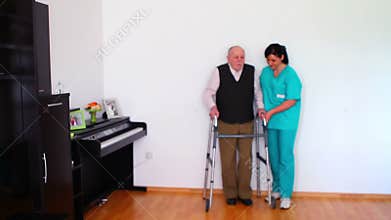 Nurse and Elderly Senior Man Using Walking Frame