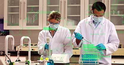 Scientists conducting experiments in lab with chemical formulas animation over them