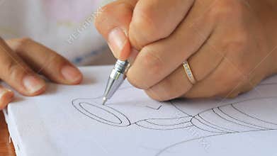 Hand drawing picture on white canvas.