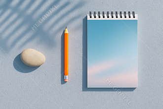 A simple still life composition featuring a notebook pencil and eraser on a textured surface