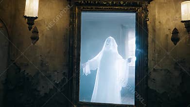 A creepy ghostly apparition in human form moves through an old haunted house