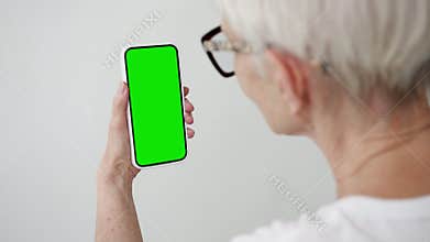 Old Woman Hand Use Smartphone with Green Screen Chroma Key Close-up