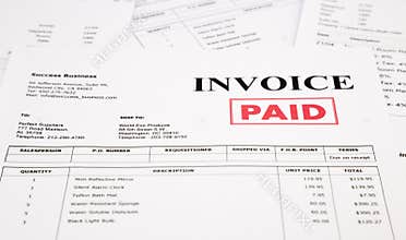 Invoice and bills with paid stamp