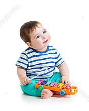 Nice baby playing with musical toys