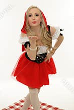 Little red riding hood blowing a kiss