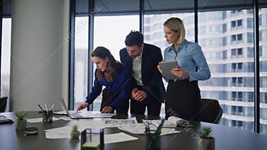 Group business people planning strategy reviewing documents at office table.