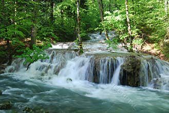 Whirling mountain river waterfall