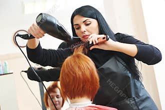 Hairdresser at work. Drying hair