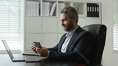 Man counting money as career progress. Office worker counting money in office success concept. Banker counting money confidently