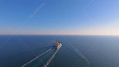 Aerial view of container ship floats in the ocean after loading in port of China