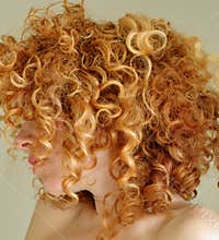 Messy curly red hair