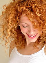 Mixed young woman with curly hair