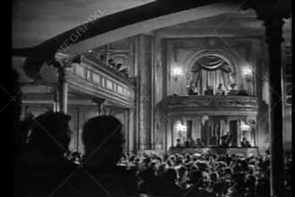 Audience in theater applauding