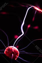 Hand and plasma ball flames on a black background