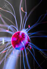 Plasma ball with magenta-blue flames