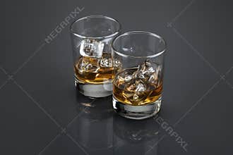 Scotch or bourbon filled glass tumblers