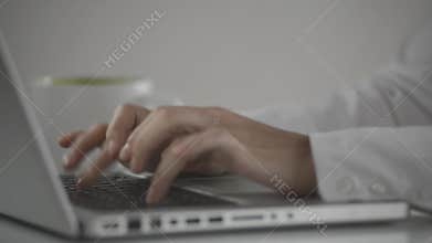 Video of young businesswoman typing on his laptop