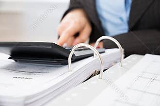 Businessperson calculating tax