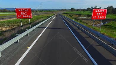 Wrong way go back road signage