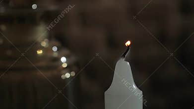 Blowing out a candle, close up