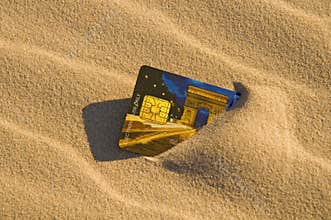 Credit card in the sand