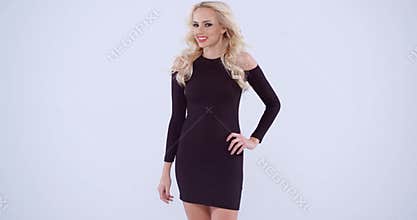 Pretty blond woman in a black dress