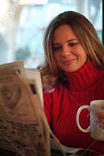 Woman reading newspaper