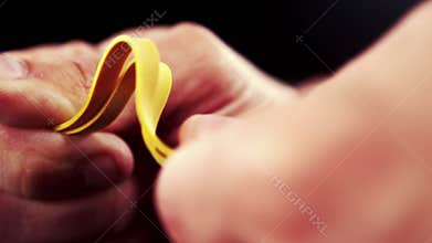 Hand pulling an elastic band