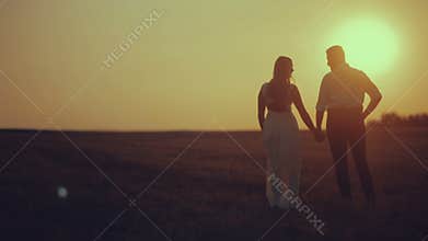Beautiful Young Couple in Love kiss in the sun
