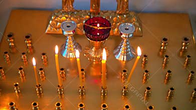 Burning Candles Before The Altar In The Church