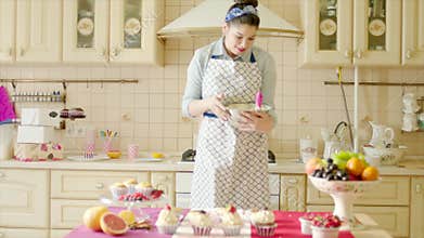 Happy woman having fun while working dough