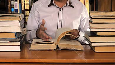 Man studying among the books