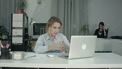 Attractive recruiter conducting job interview using laptop