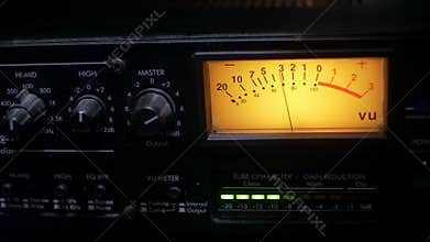 Closeup of a functioning audio compressor in a sound recording studio