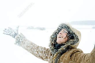 Happy Woman in Snowstorm