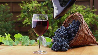 Wine is poured into a glass carafe