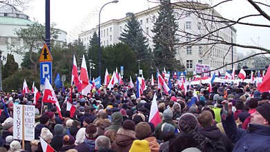 WARSAW, POLAND - DECEMBER, 17, 2016. Protesters with Polish and EU flags in the street. 4K overhead pan shot